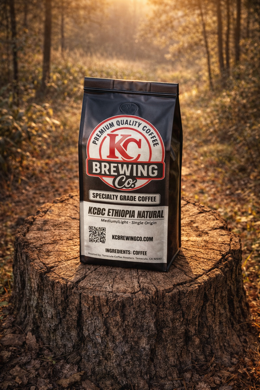 KC Brewing Co premium quality Ethiopia Natural coffee bag on a tree stump in a sunlit forest