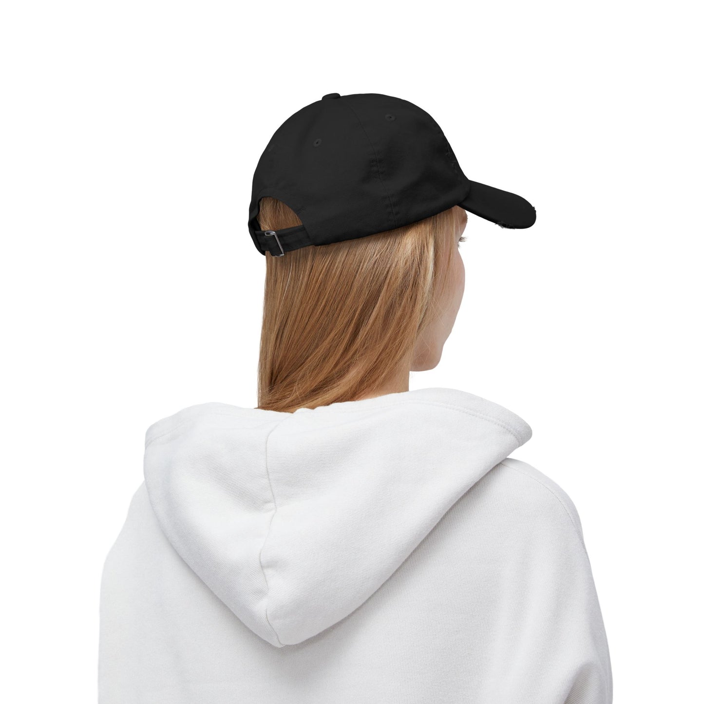 Person wearing a black cap and white hoodie on a white background