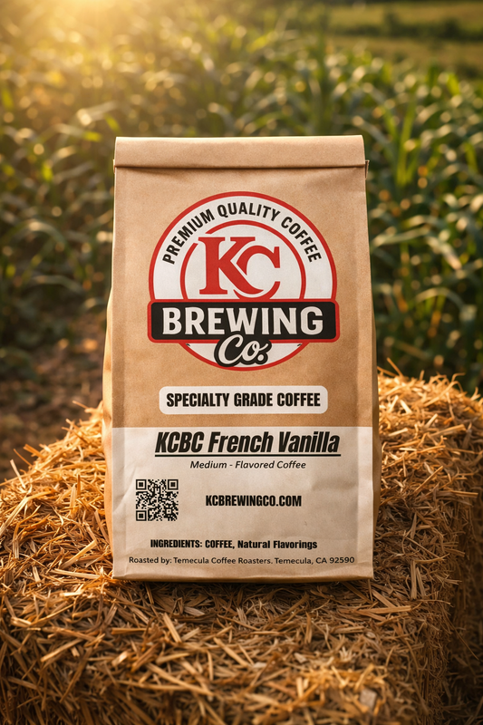 Bag of KC Brewing Co KCBC French Vanilla medium-flavored specialty grade coffee on straw bale in outdoor field